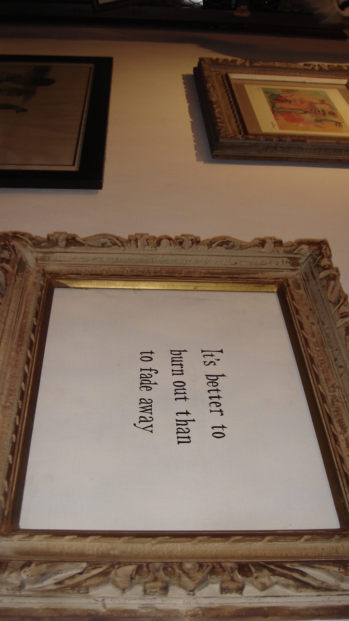 Words displayed in an ornate frame at a Yokohama vintage shop